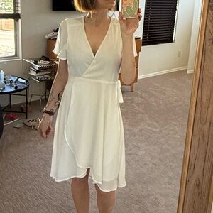 Like New! Lulu's Rise To the Occasion White Wrap Dress with Flutter Sleeves!